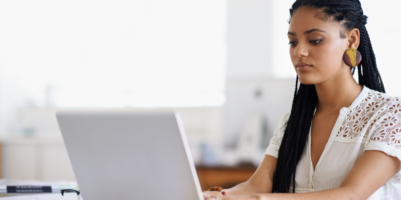 woman typing on laptop